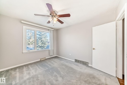 Room with light gray wall paint and gray carpeting - 9716 162 Street, Edmonton, AB - Indoor Photo Showing Other Room