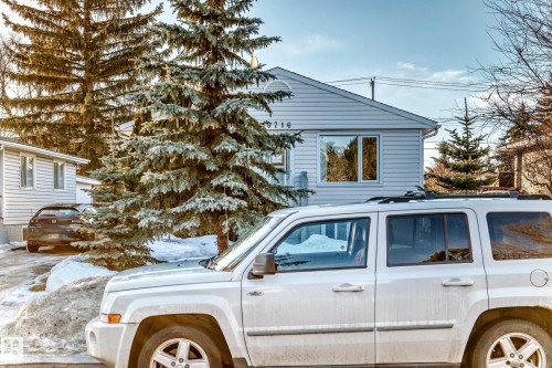 Single-story property featuring light-colored siding and a contrasting dark roofline - 9716 162 Street, Edmonton, AB - Outdoor