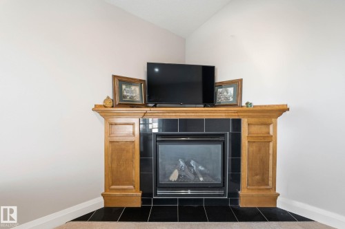 515 Callaghan Point(E), Edmonton, AB - Indoor Photo Showing Other Room With Fireplace