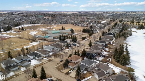 The property is situated within a well-established residential area, offering views of surrounding homes and green spaces - #1 Colonial Close, Beaumont, AB - Outdoor With View