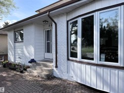 White brick and horizontal siding exterior with dark brown trim - 