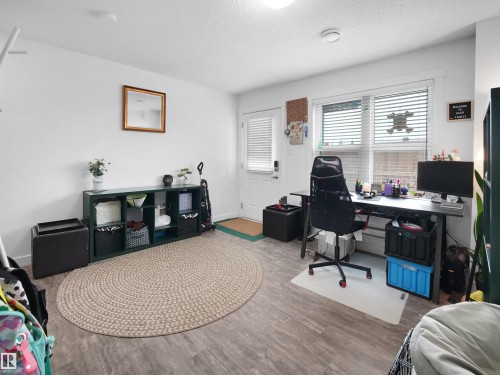 This versatile room features light-colored walls and a window with blinds, providing natural light - 64 655 Watt Boulevard, Edmonton, AB - Indoor Photo Showing Office