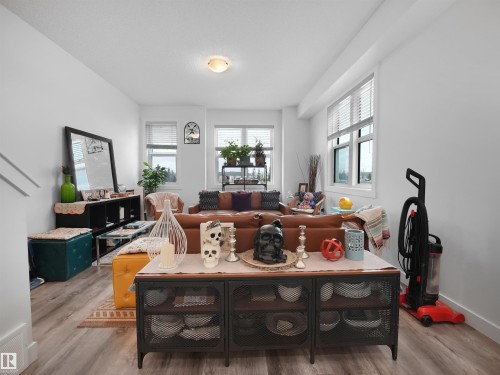 The living room features light-toned flooring and white walls, creating a bright and airy atmosphere - 64 655 Watt Boulevard, Edmonton, AB - Indoor