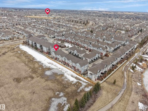 Aerial view of the community, showcasing residential properties with grey roofs - 64 655 Watt Boulevard, Edmonton, AB - Outdoor With View