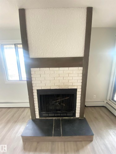 302 10826 113 Street, Edmonton, AB - Indoor Photo Showing Living Room With Fireplace