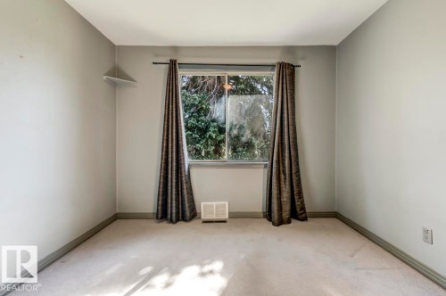 Light gray painted walls with coordinating trim - 9602 90 Street, Edmonton, AB - Indoor Photo Showing Other Room