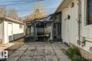 Sunroom addition featuring glass panels and a sliding screen door - 9602 90 Street, Edmonton, AB  - Outdoor With Exterior 