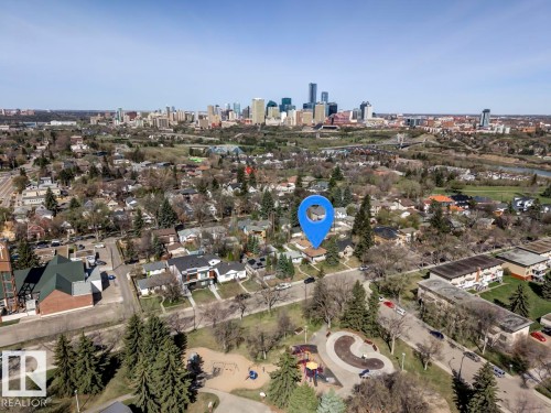Aerial overview showcasing a residential district with a prominent city skyline in the background - 9602 90 Street, Edmonton, AB - Outdoor With View