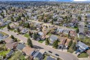 Aerial perspective showcasing a residential neighborhood with numerous single-family homes, mature trees, and paved streets - 3520 19 Avenue, Edmonton, AB  - Outdoor With View 