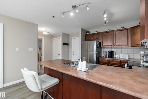 301 530 Hooke Road, Edmonton, AB - Indoor Photo Showing Kitchen With Double Sink