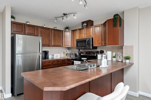 301 530 Hooke Road, Edmonton, AB - Indoor Photo Showing Kitchen With Double Sink
