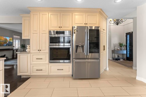 Kitchen featuring light-colored cabinetry, stainless steel appliances, and tile flooring - 515 Lakeshore Drive, Cold Lake, AB - Indoor Photo Showing Kitchen