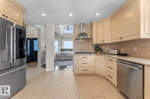 The kitchen features recessed lighting, light-toned cabinetry, stainless steel appliances, and a tiled backsplash - 515 Lakeshore Drive, Cold Lake, AB - Indoor Photo Showing Kitchen