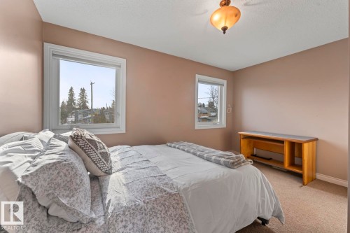 The property features walls in a neutral tone, carpeted flooring, and a ceiling light fixture - 515 Lakeshore Drive, Cold Lake, AB - Indoor Photo Showing Bedroom