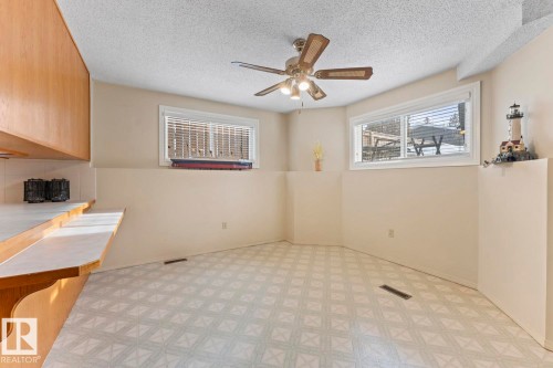 Spacious area featuring neutral-toned walls, a patterned floor, and a ceiling fan with integrated lighting - 515 Lakeshore Drive, Cold Lake, AB - Indoor Photo Showing Other Room