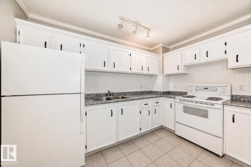 11 2024 57 Street, Edmonton, AB - Indoor Photo Showing Kitchen With Double Sink