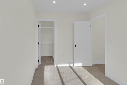 Carpeted room featuring recessed lighting, white walls, and white trim - 7936 91 Avenue, Edmonton, AB - Indoor Photo Showing Other Room