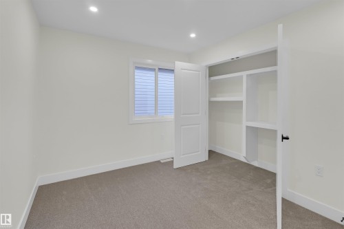 Neutral-toned room with carpet flooring and recessed lighting - 7936 91 Avenue, Edmonton, AB - Indoor