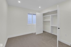 Neutral-toned room with carpet flooring and recessed lighting - 
