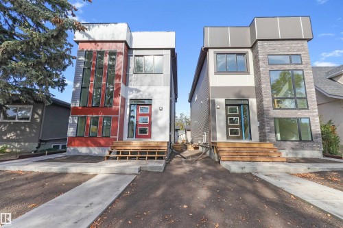 Contemporary duplex featuring distinct facades with multi-pane windows and wood-finish entry stairs - 7936 91 Avenue, Edmonton, AB - Outdoor With Facade
