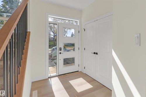 Entryway featuring a contemporary white door with multiple glass lites, a transom window, and a sidelite - 7936 91 Avenue, Edmonton, AB - Indoor Photo Showing Other Room