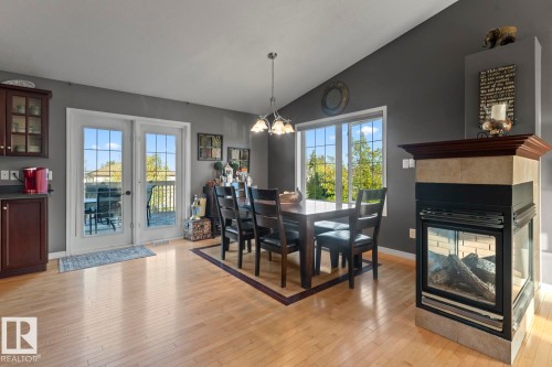 802 26 Street, Cold Lake, AB - Indoor Photo Showing Dining Room With Fireplace