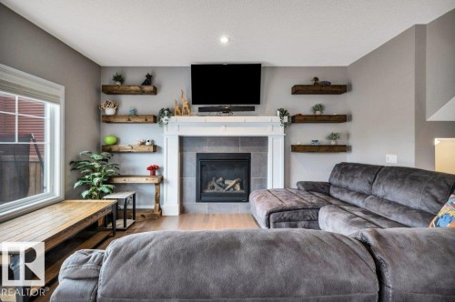 3721 Cherry Loop, Edmonton, AB - Indoor Photo Showing Living Room With Fireplace