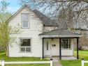 Two-story residence featuring white siding and a covered front porch with dark pillars - 4322 53 Street, Wetaskiwin, AB  - Outdoor 