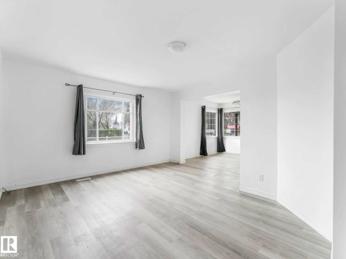 Bright interior space with light-toned wood-finish flooring - 4322 53 Street, Wetaskiwin, AB - Indoor