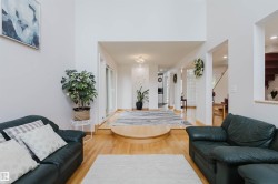 Hardwood flooring extending through multiple open archways - 