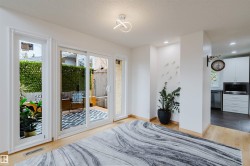 Hardwood-finish flooring extending from the living area into the adjacent space - 