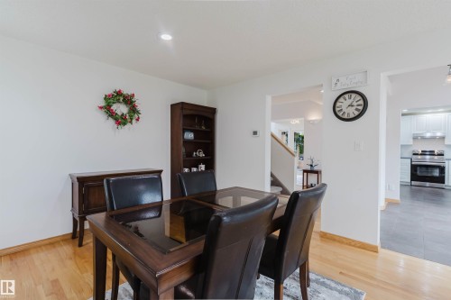 Dining area featuring wood-finish flooring, white walls, and recessed lighting - 342 O'Connor Close, Edmonton, AB - Indoor