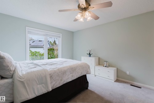 Carpeted room with light-colored walls and a window featuring white trim - 342 O'Connor Close, Edmonton, AB - Indoor Photo Showing Bedroom