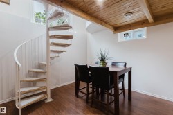 White spiral staircase with wood-finish treads - 