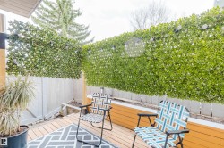 Outdoor decking with light wood-finish planks - 