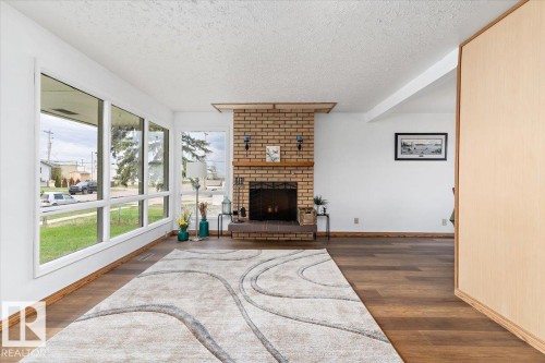 4916 51 Avenue, Ryley, AB - Indoor Photo Showing Living Room With Fireplace