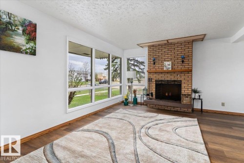 4916 51 Avenue, Ryley, AB - Indoor Photo Showing Living Room With Fireplace