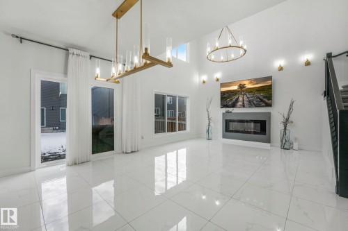 5741 Kootook Way, Edmonton, AB - Indoor Photo Showing Other Room With Fireplace