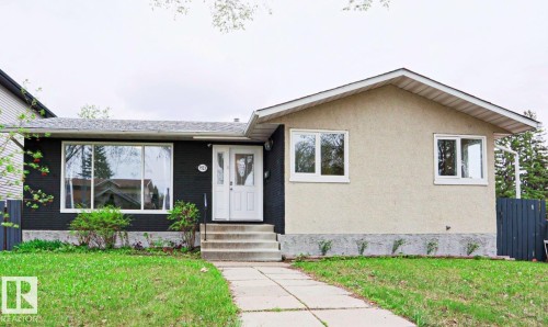 Curb appeal featuring a split-level facade with contrasting black and stucco finishes - 9523 151 Street, Edmonton, AB - Outdoor