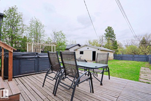 Wood-finish deck featuring a built-in spa - 9523 151 Street, Edmonton, AB - Outdoor With Deck Patio Veranda With Exterior