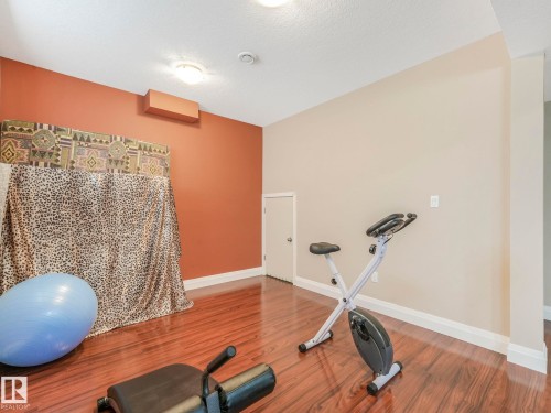 6911 17 Avenue, Edmonton, AB - Indoor Photo Showing Gym Room