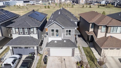 Contemporary two-story residence featuring a gray exterior with white trim, a dark shingle roof, and an attached two-car garage - 9651 229 Street, Edmonton, AB - Outdoor