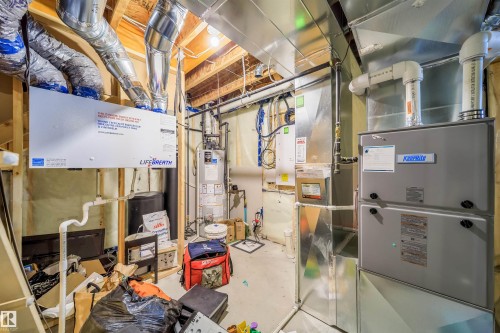 Equipped with a Lifebreath heat recovery ventilator, KeepRite furnace, and visible ductwork - 9651 229 Street, Edmonton, AB - Indoor Photo Showing Basement