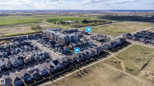 Aerial perspective of a developed residential area featuring a mix of detached homes and multi-story apartment buildings - 9651 229 Street, Edmonton, AB - Outdoor With View