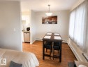 Photo has been digitally enhanced. - 10 11108 108 Avenue, Edmonton, AB  - Indoor Photo Showing Dining Room 