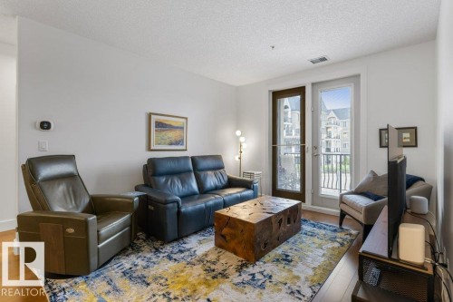 255 6079 Maynard Way, Edmonton, AB - Indoor Photo Showing Living Room