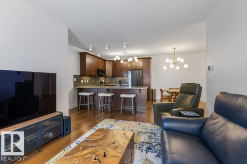 255 6079 Maynard Way, Edmonton, AB - Indoor Photo Showing Living Room