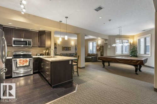 255 6079 Maynard Way, Edmonton, AB - Indoor Photo Showing Kitchen With Stainless Steel Kitchen