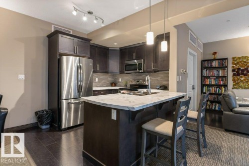 255 6079 Maynard Way, Edmonton, AB - Indoor Photo Showing Kitchen With Stainless Steel Kitchen