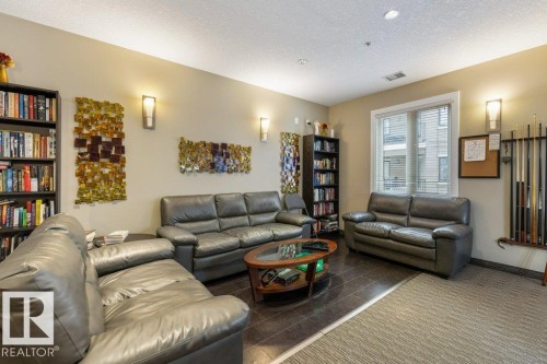 255 6079 Maynard Way, Edmonton, AB - Indoor Photo Showing Living Room